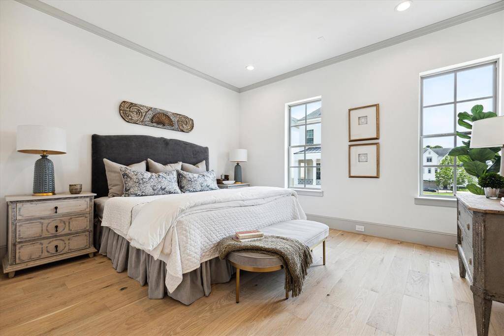 Light-filled Primary Suite with His and Hers walk-in closets and luxurious bath.