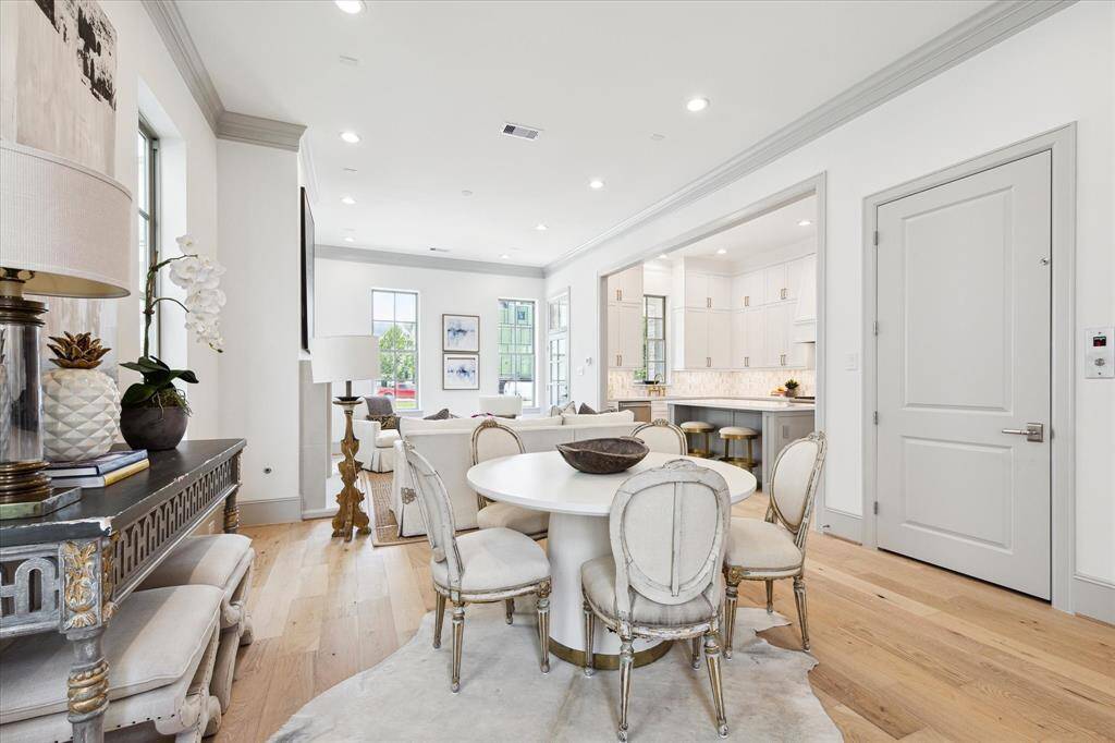 Open layout Living and Dining; Elevator installed at door on right.