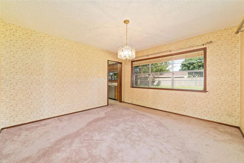 The dining room is just off of the kitchen and living room and had a beautiful view of the back yard.