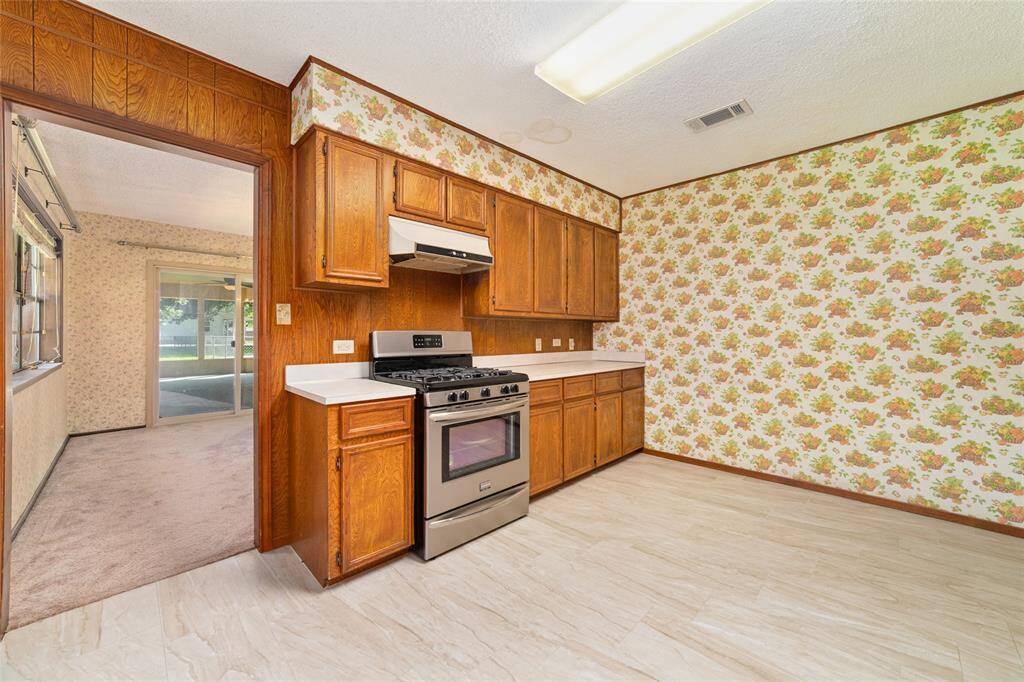 Another view of the kitchen which connects through to the dining room.