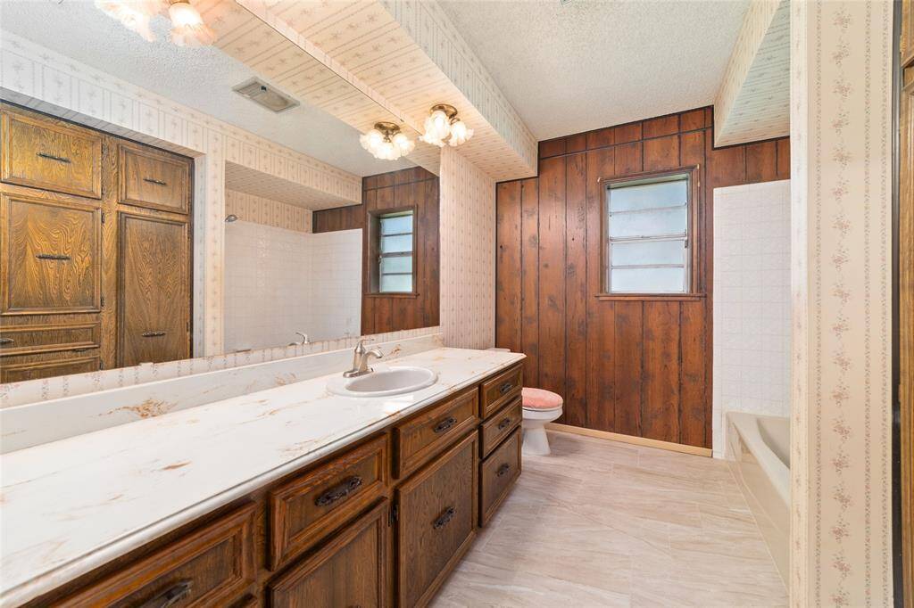 Second bathroom is large with a ton of cabinet space and a tub/shower combination.
