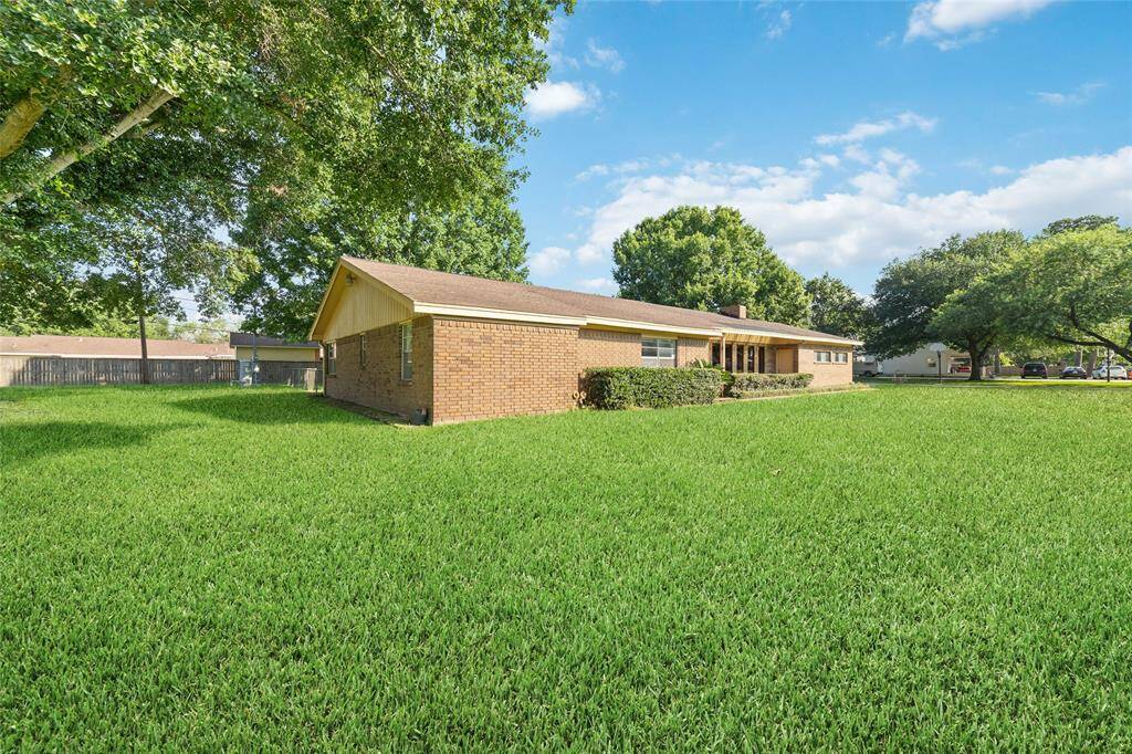 Well manicured lawn. This property sits on almost one acre of land.