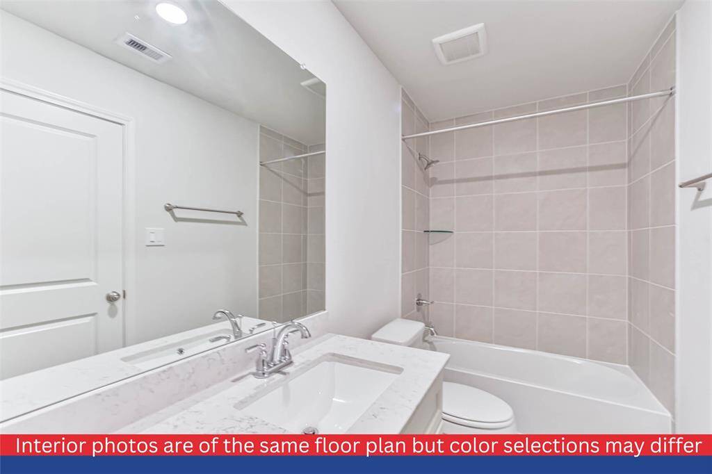 A second bathroom, conveniently located near the bedrooms, features modern fixtures and a stylish design. It caters to both functionality and aesthetics, ensuring a pleasant experience for all.