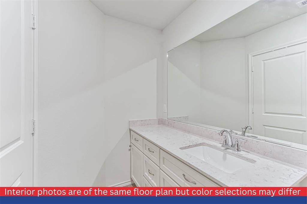 A second bathroom, conveniently located near the bedrooms, features modern fixtures and a stylish design. It caters to both functionality and aesthetics, ensuring a pleasant experience for all.
