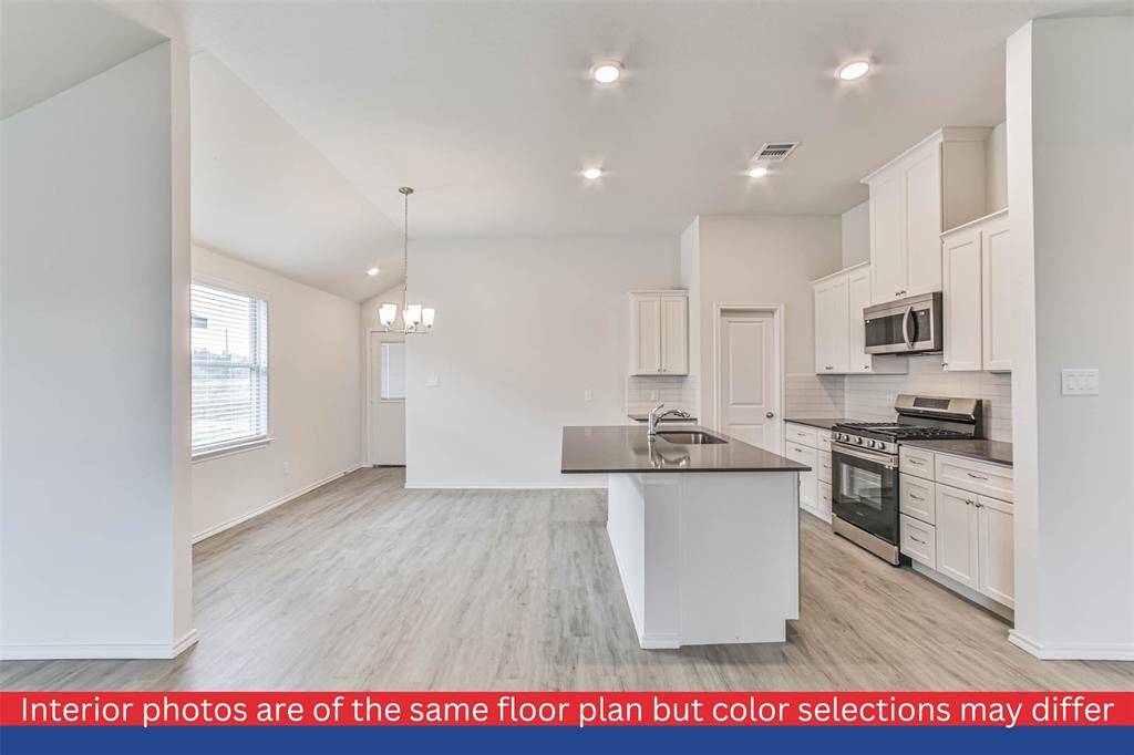 The open-concept layout creates a seamless flow, making it an ideal space for entertaining guests or enjoying quality time with your loved ones.
