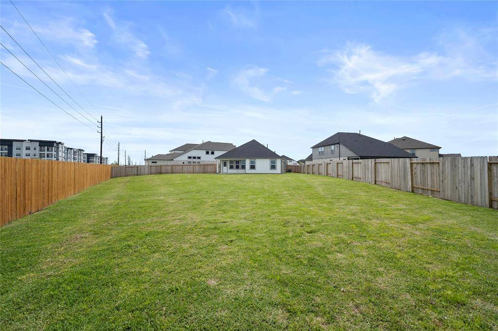 Come and see this spacious backyard. There is plenty of room for the kids to play and adults to relax! The possibilities are endless!