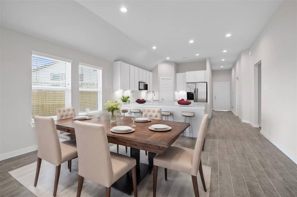 The open concept living room and kitchen makes for a great way to keep the party going and never miss a beat!