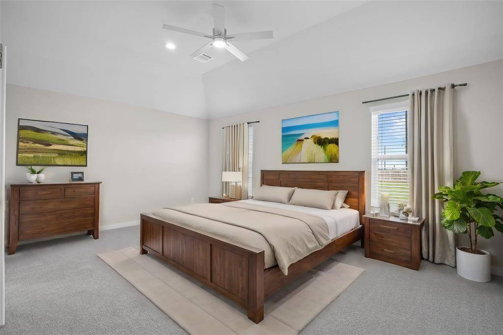 Come and unwind after a long day in this magnificent master suite! This spacious room features plush carpet, warm paint, sitting area, high ceilings, beautiful custom ceiling fan, and large windows with privacy blinds!