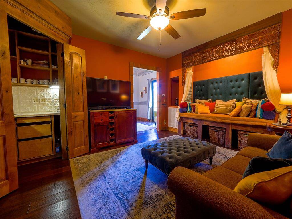 Sitting area in the upstairs primary suite with a kitchenette.