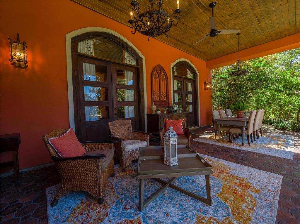 Back porch has doors into the formal dining room