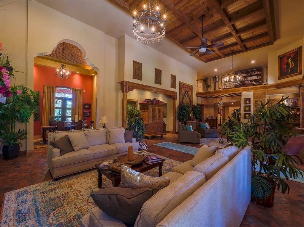 Looking toward the dining room from beside the fireplace.  Note the balcony just right of center.