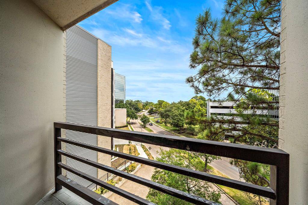 Take in the gorgeous hues of the city as you enjoy tree-lined views of Tanglewood from the primary suite's balcony.