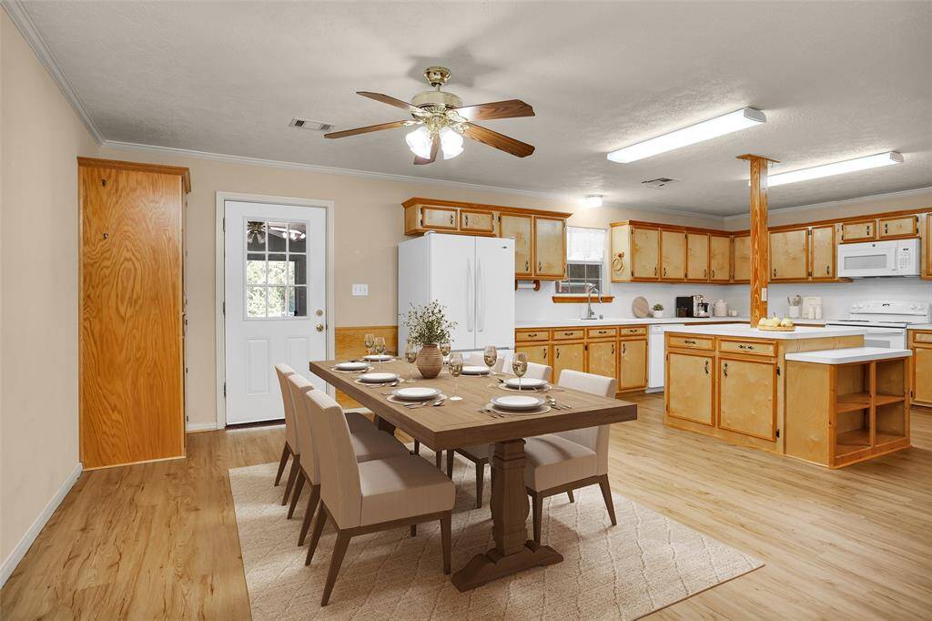 Spacious dining area with room for a table for 6-8 and a buffet on the left wall. Virtually staged for inspiration.