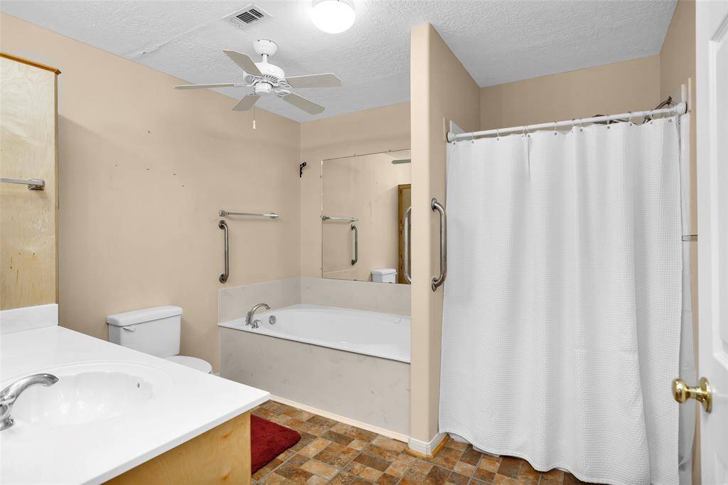 Spacious bathroom with modern amenities for ultimate comfort.