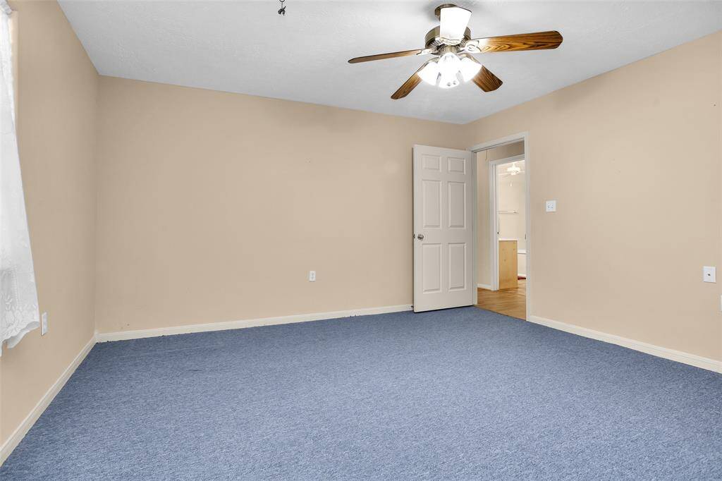 Spacious second bedroom with ample natural light.
