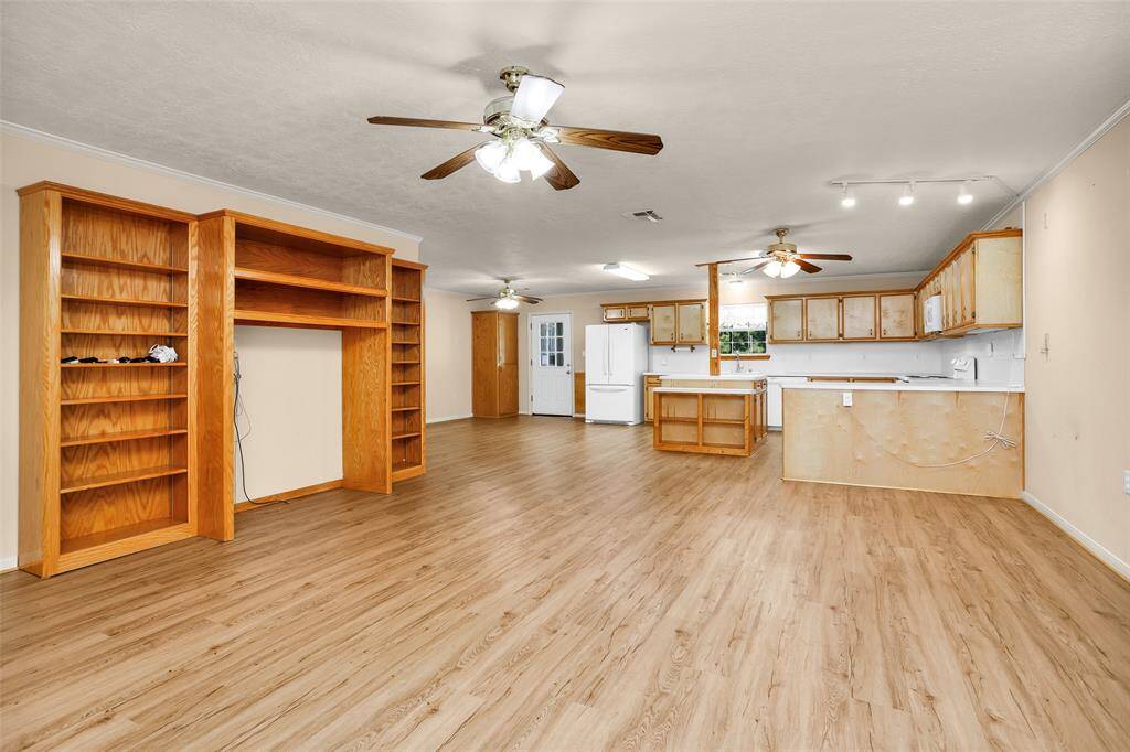 Luxurious LVP flooring complements the neutral tones, offering a versatile canvas for your personal style.