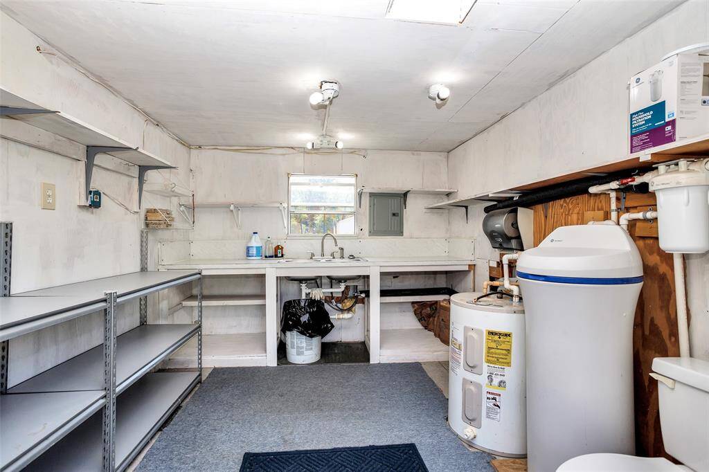 Spacious 11.3x9.4 utility shed with convenient half bath—perfect for extra storage and functionality.