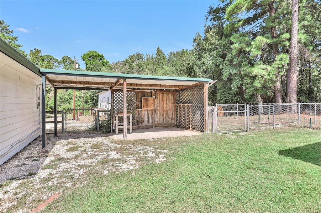 Explore the spacious, fenced side yard, perfect for outdoor activities and relaxation.