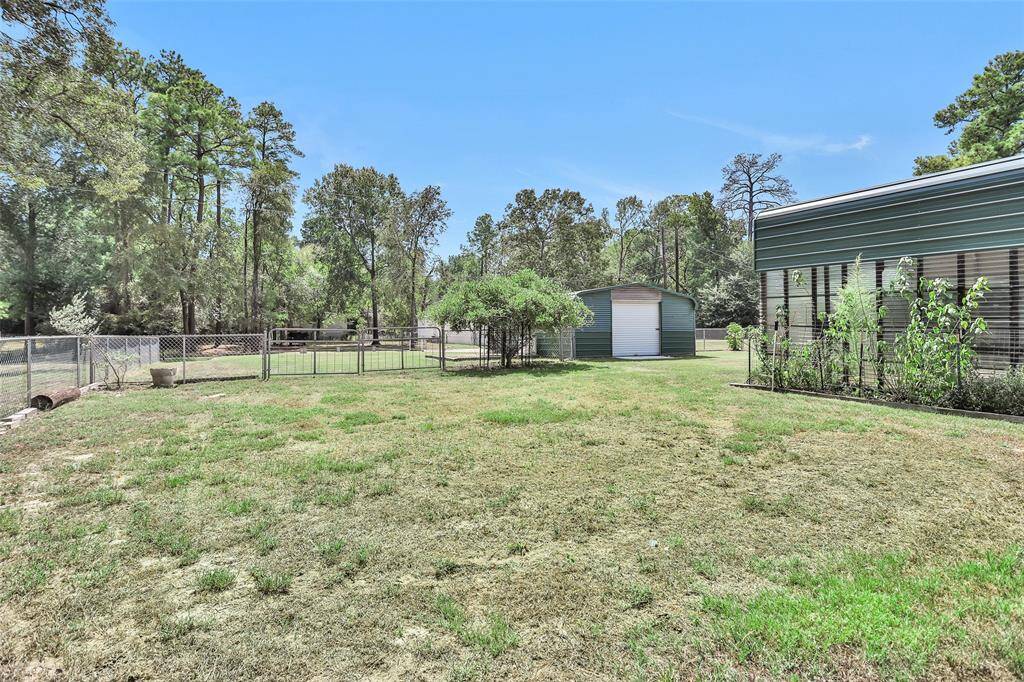 Spacious fenced yard with convenient double gates.