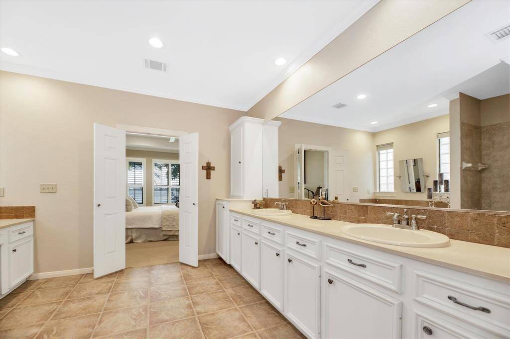 Double sinks and tons of cabinets and counter top space.