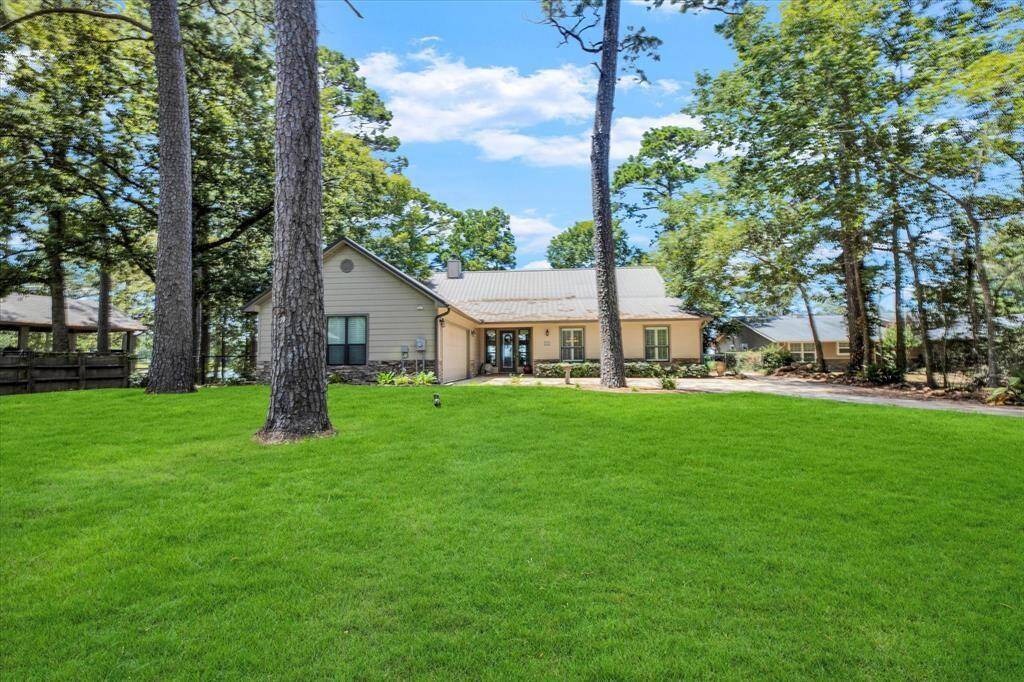 This custom waterfront home over looks the Lake Livingston sunsets.
