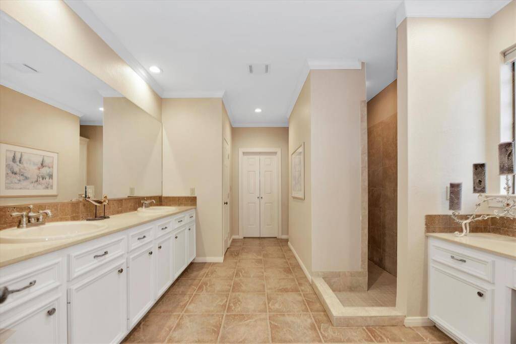 Spacious 11x17 primary bath has a huge walk-in shower.
