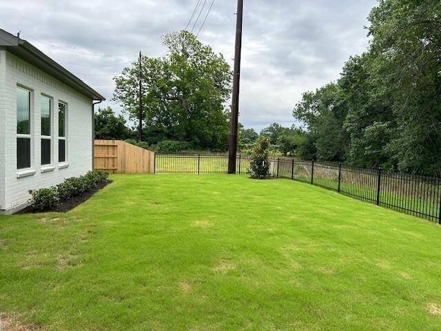 Side yard gives space between you and the neighbor and could be a perfect dog run if needed.