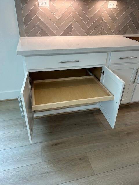 Kitchen shelves are movable below.