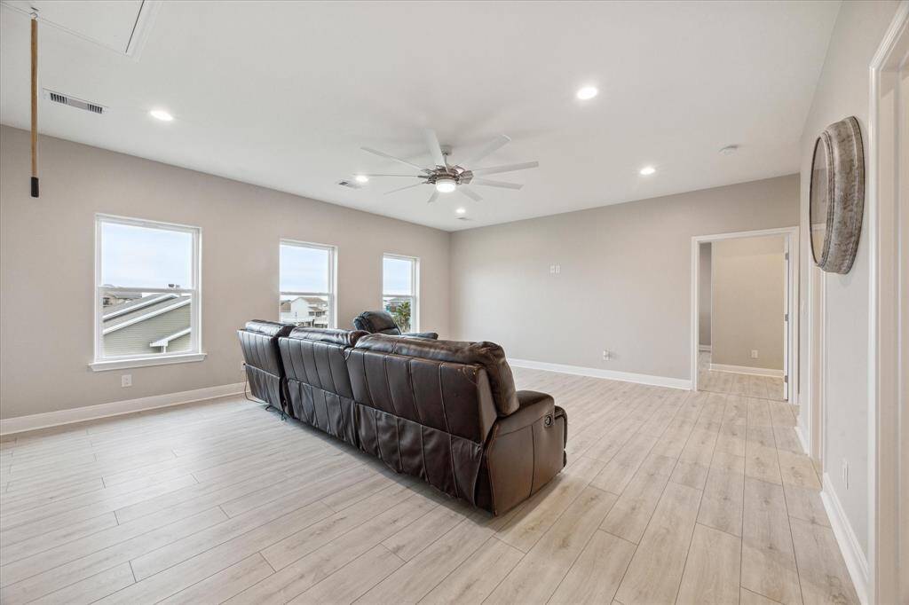 large family room on 3 floor looking toward primary entrance
