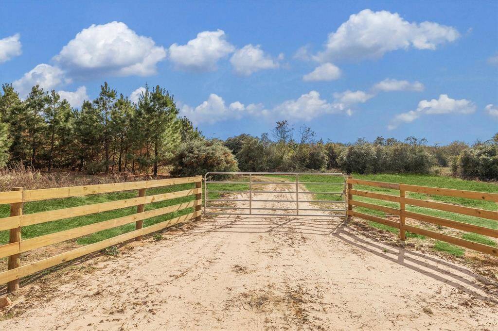 New fence and gated entry.