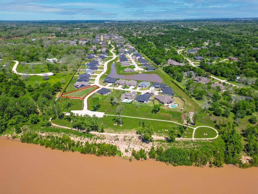 The Brazos River Sits Behind Your Lot!  3033 Whispering Pecans Dr. Fulshear, TX  77441