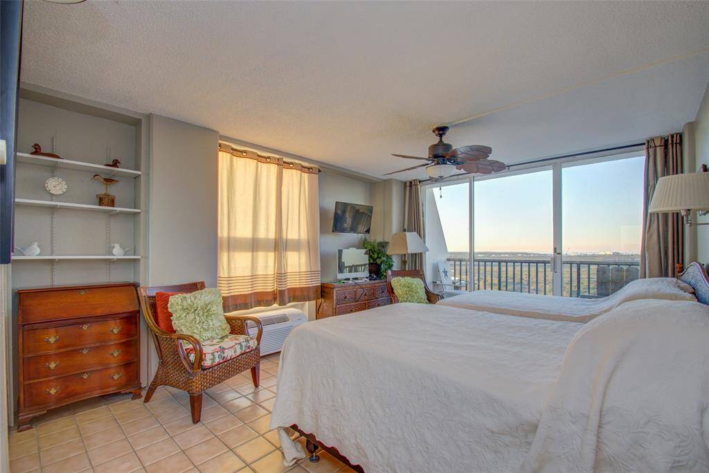 Built in shelving compliments this secondary bedroom.