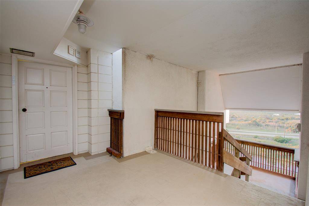 Covered breezeway entrance to the home.