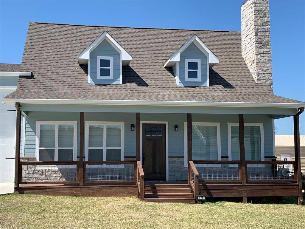 Nice wide front porch with view of the water down the street