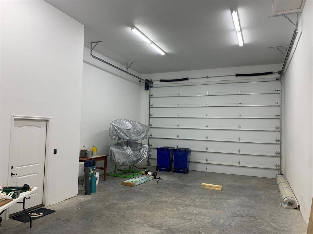 Extra large garage space big enough for RV, boat or multiple vehicles with extra space for workshop in the back