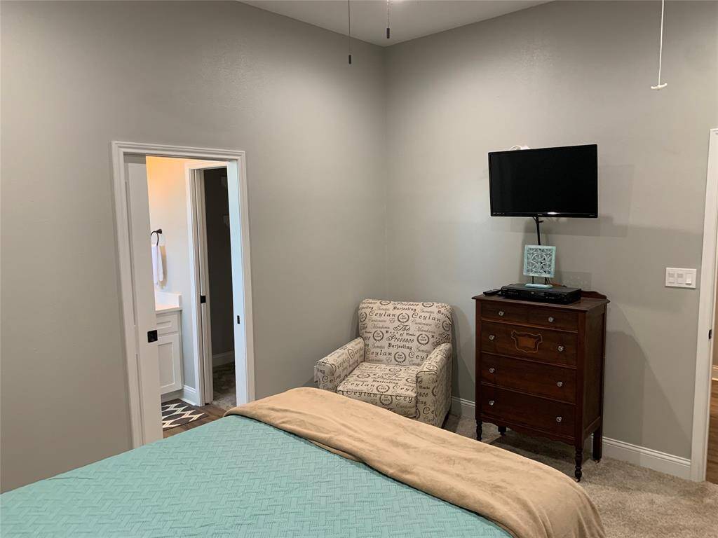 Primary bedroom with attached bathroom