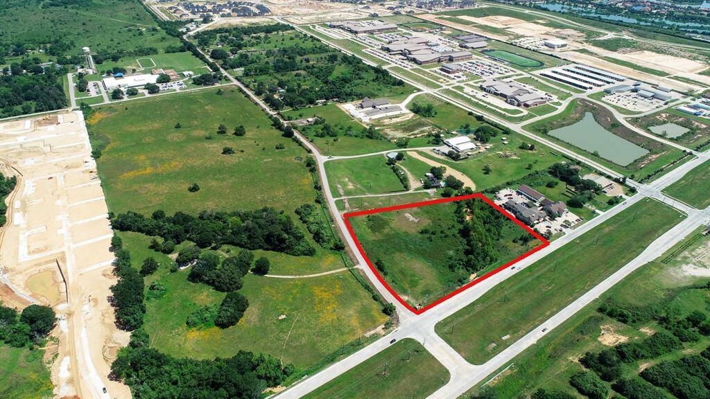 This birds eye view provides a closer look at the intersection. Also, notice the dirt work being done to the west. This is proposed to be mixed use development with high-end retail along FM 1093 and single family homes behind that stretches to Huggins Road that is in the process of being widened and will be a major east/west collector road.
