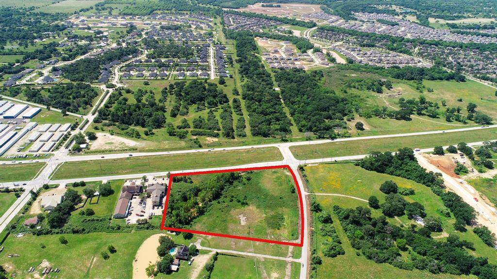 Looking south across the property, offers a glimpse of the intersection at FM 1093 and Fulshear/Katy Road. Also noticed on the left, is Charger Way that is on the north side of FM 1093 that accesses the Fulshear Junior and High schools. Charger Way on the southside of FM 1093 becomes Bois d' Arc; one of the most desired areas in Fulshear.