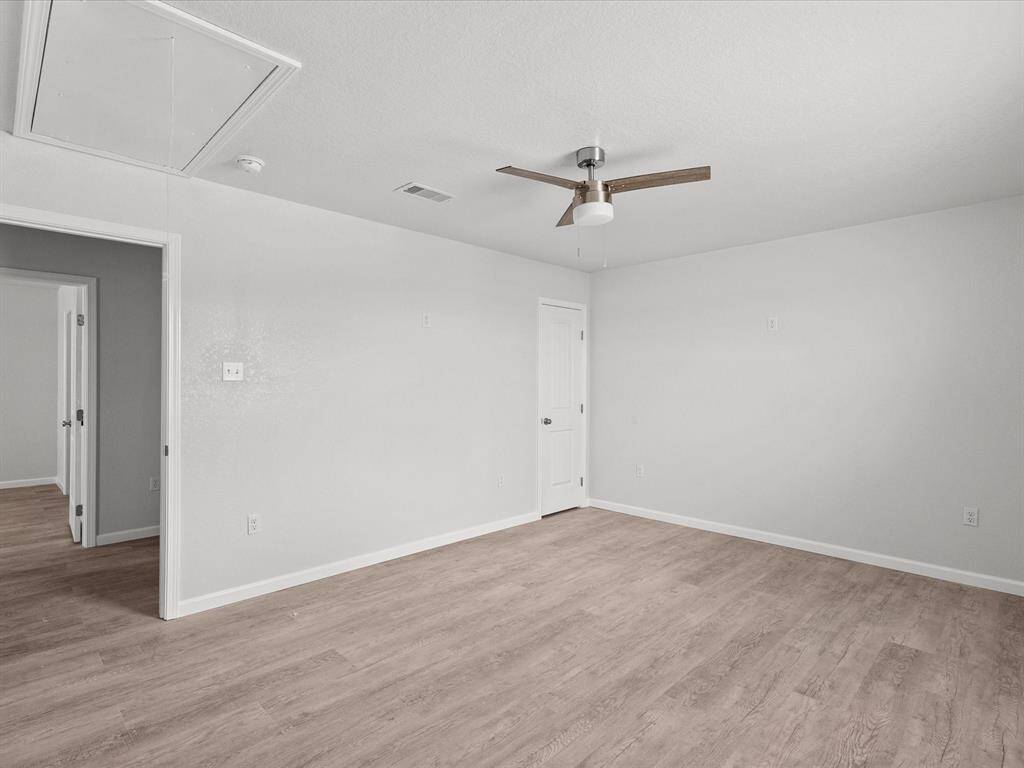 Serene and spacious back bedroom with modern finishes, perfect for relaxation.