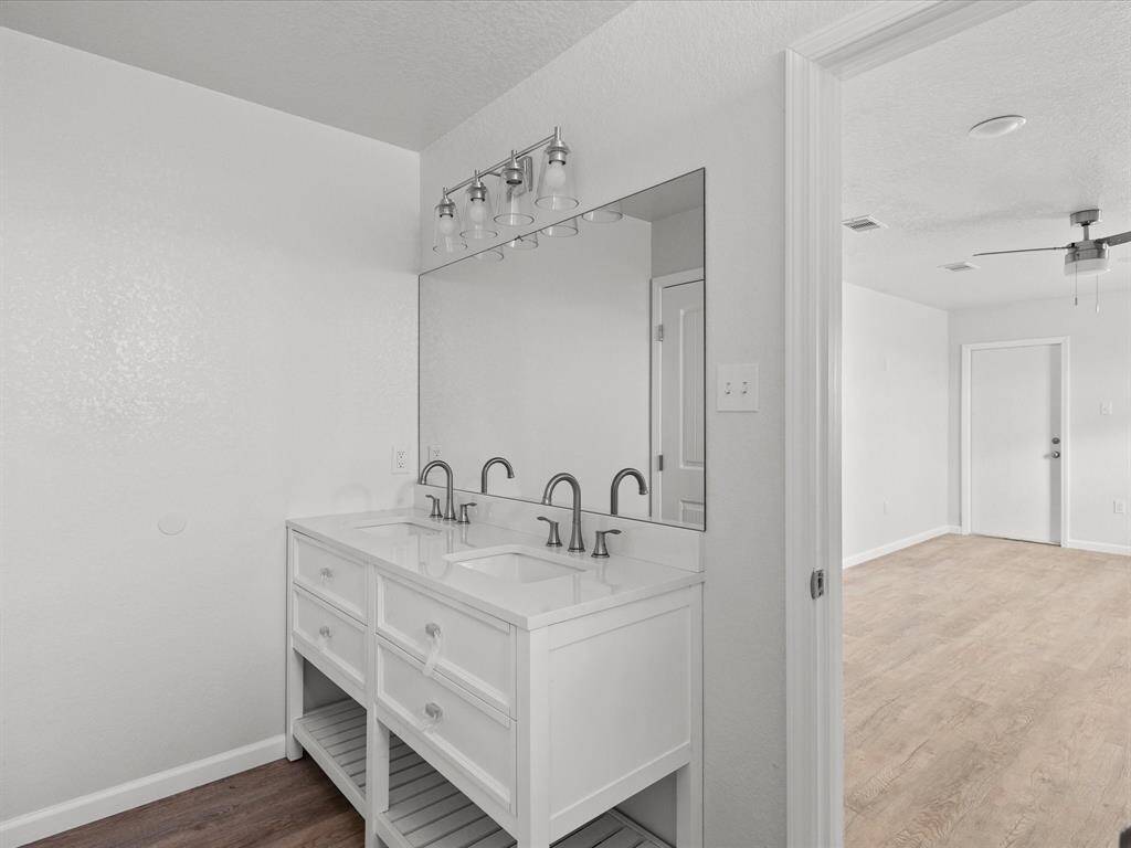 Enjoy the convenience of a stylish double vanity in the master bath.