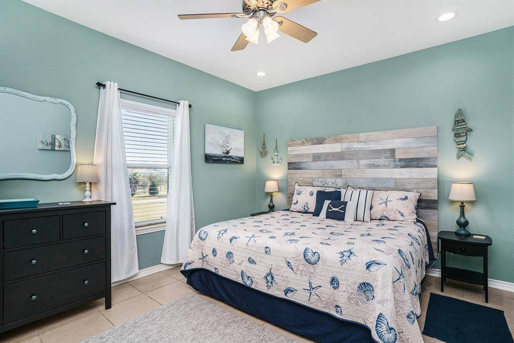 Oversized primary bedroom with a private bathroom and walk-in closet.