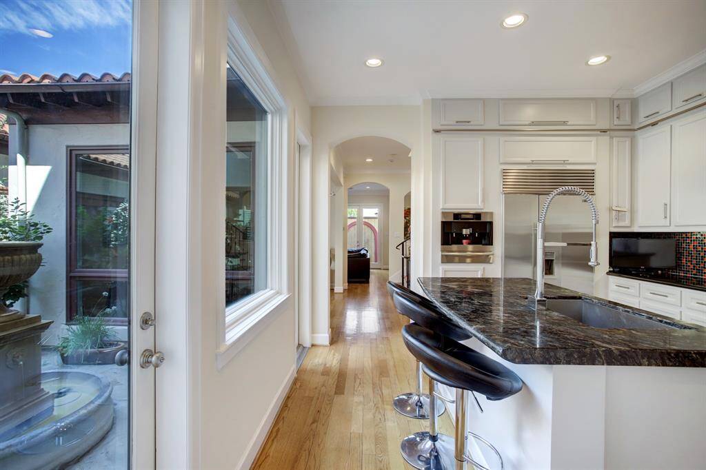 Enter this well planned Chef's kitchen with all the best of appliances and enjoy your guests while they keep you company at the Breakfast Bar and you enjoy the outdoor views!