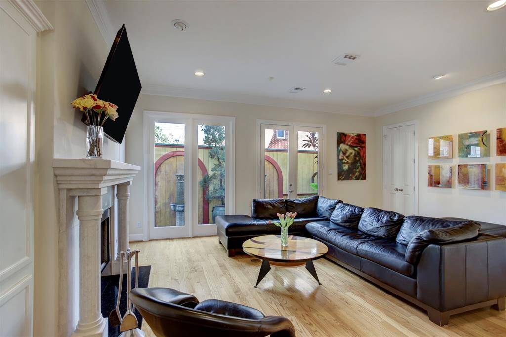 Against the wall adjacent to the fireplace you will find another large storage area behind doors where more of your pantry and serving items can remain safely and conveniently stored for entertaining.
