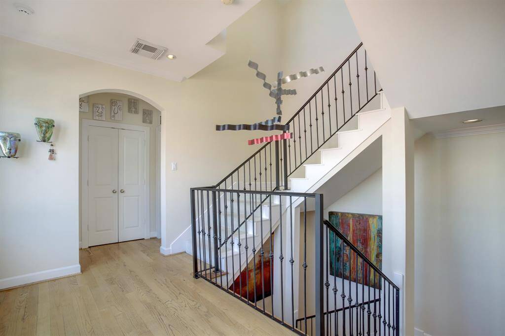 Privacy nook is the entrance to the 2nd floor utility room to the right, a storage closet behind double doors and another ensuite bedroom to the left.