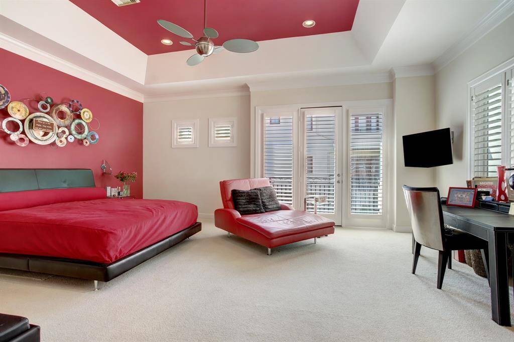 These Art Collector Owners have outfitted their custom Primary bedroom to show off the eclectic metal art over their bed.  As you can see, there is access to a balcony as seen from the first images in this listing.  There is also plenty of space for a seating area or, in this case, for a desk for multi-tasking.