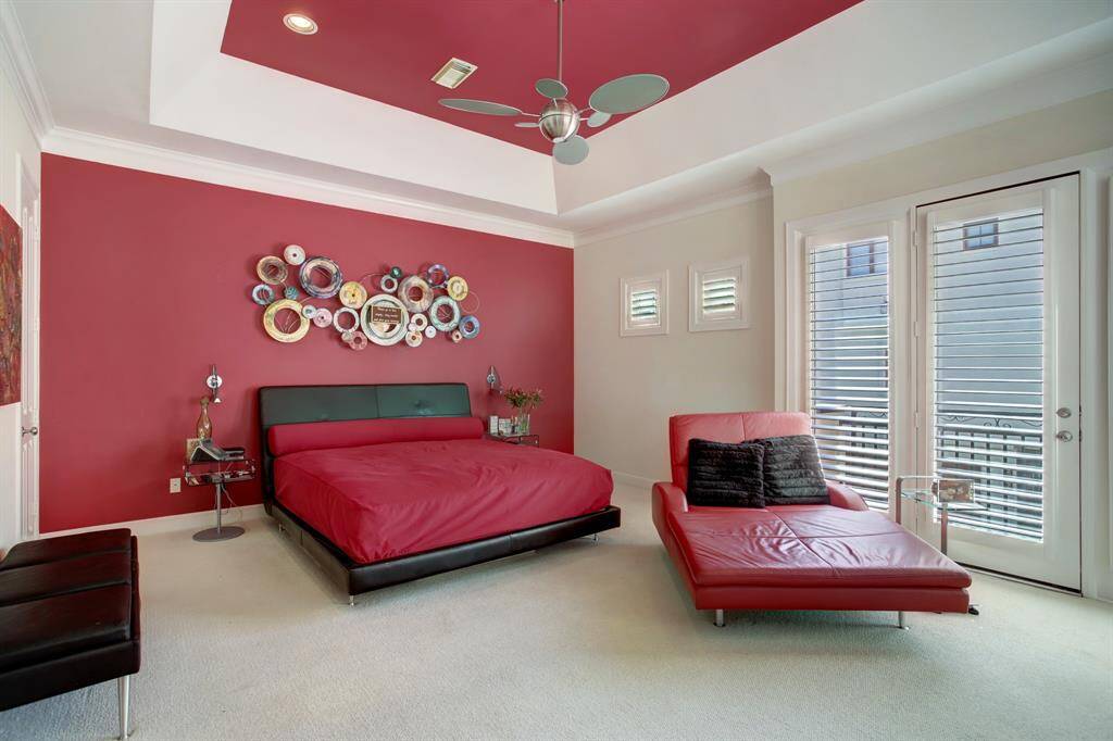 Don't miss the vaulted tray style ceiling adding to the open and bright feel of this nice sized room!  Note the wall of light provided by the French doors and the cleverly placed windows placed high on the wall to capture just the right amount of light.