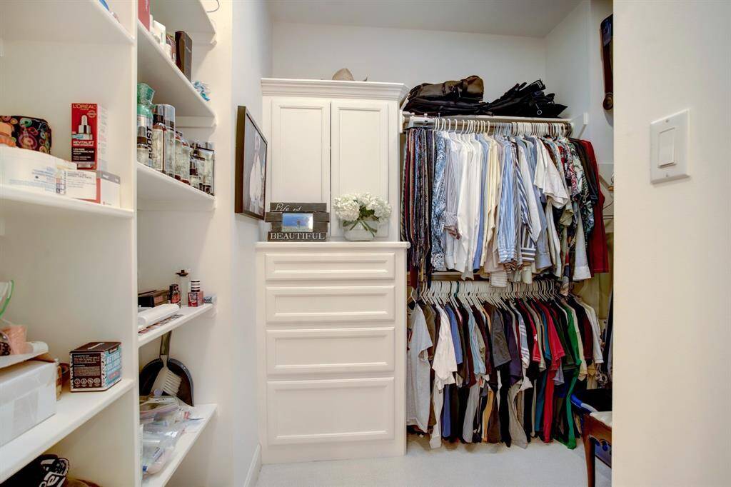 This closet is located at the other end of the Primary bath and has well thought out built-ins and shelving.