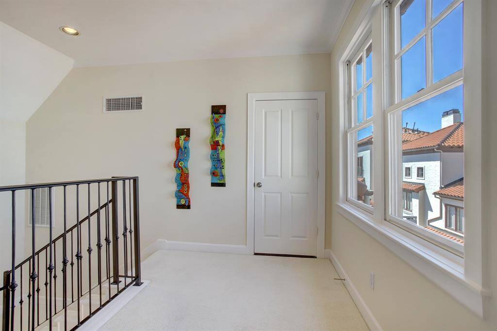 Just when you thought it could not get any better, you top the staircase to find more views of your Mediterranean lifestyle with the red clay roof tops and more lighwashed spaces!
