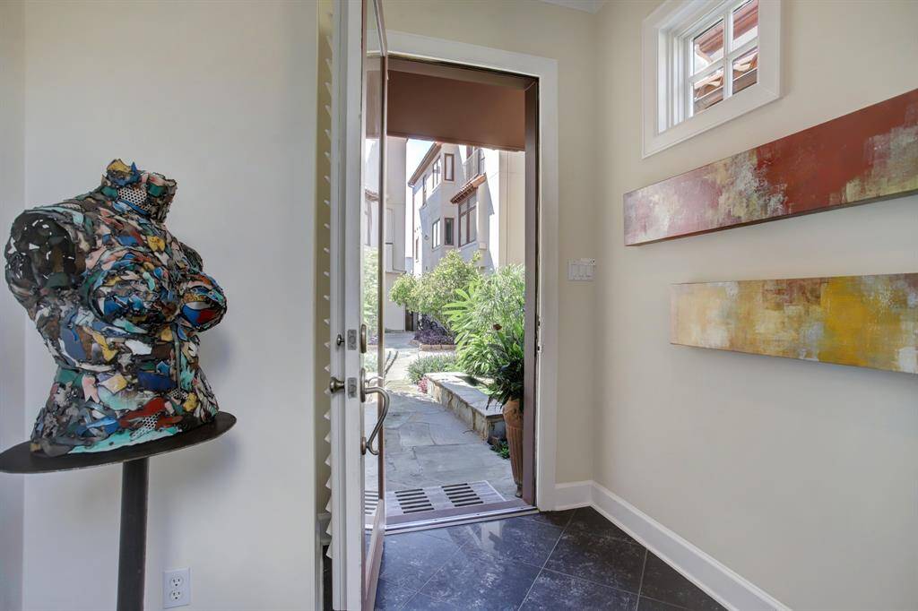 Looking back over your shoulder towards the entrance, you can get the sense of the European Village feel and see the small window cleverly placed high in the wall to provide light but maintain privacy and wall space for your art.