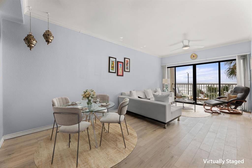 Spacious living dining with floor to ceiling doors to enjoy the gorgeous views - virtually staged